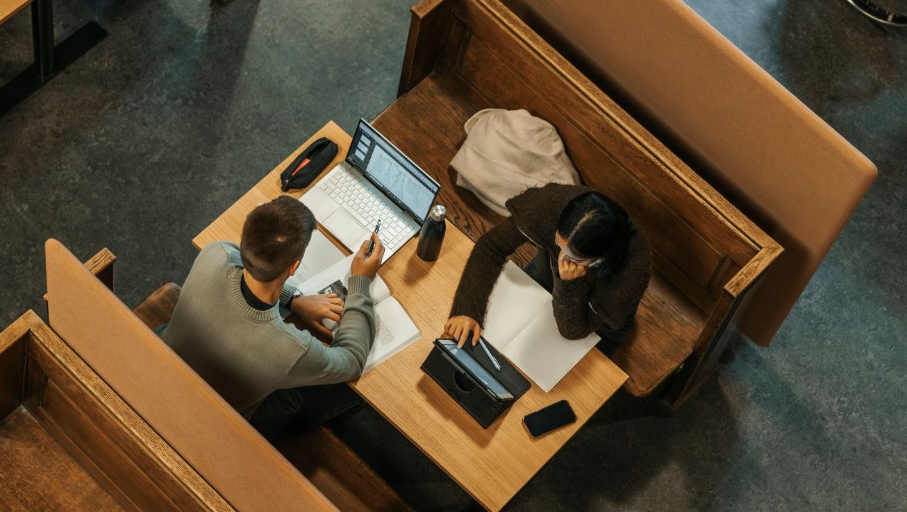 Two candidates in library booth 